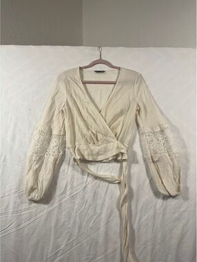 Express cream wrap blouse with lace sleeves